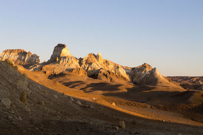 Scenic view of desert against clear sky