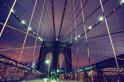 Low angle view of suspension bridge at night