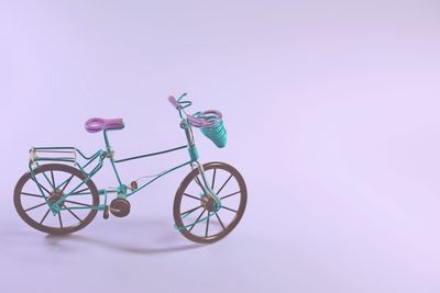 Bicycle toy against purple background