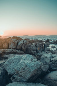 Scenic view of sea against clear sky during sunset