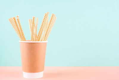 Close-up of orange juice against blue background