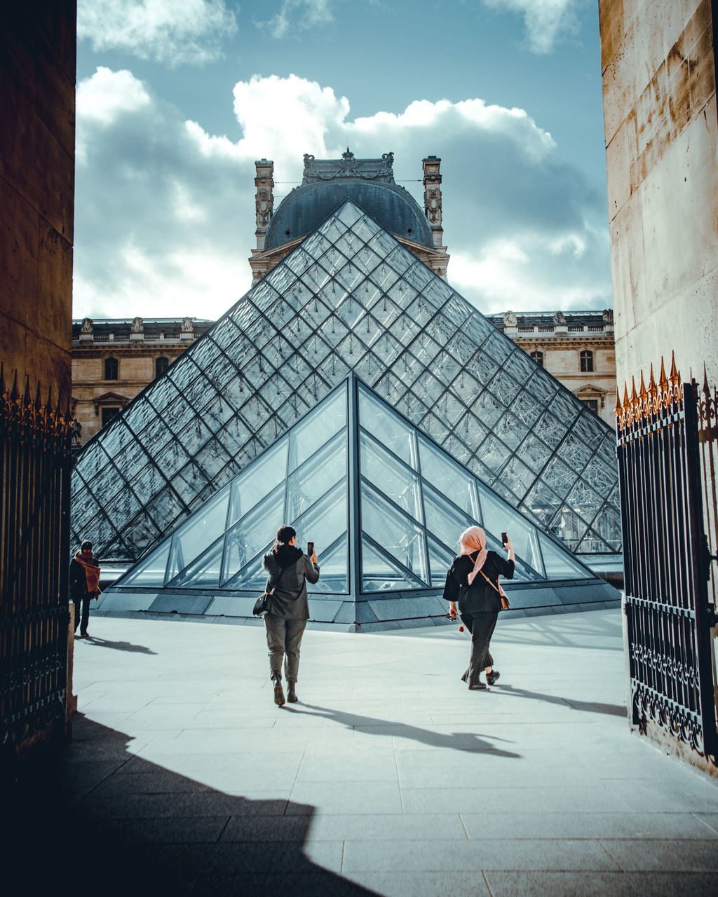 architecture, built structure, building exterior, real people, full length, men, sky, cloud - sky, city, adult, day, building, people, group of people, tourism, women, nature, travel, travel destinations, outdoors