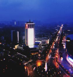 High angle view of illuminated buildings in city at night