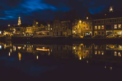 Reflection of illuminated buildings in water at night
