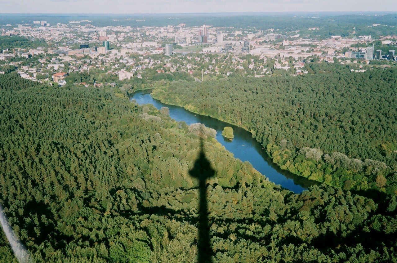 building exterior, architecture, cityscape, high angle view, built structure, water, city, aerial view, sea, crowded, residential district, coastline, residential building, residential structure, elevated view, tree, town, landscape, river, townscape