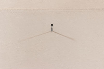 High angle view of shadow on white wall