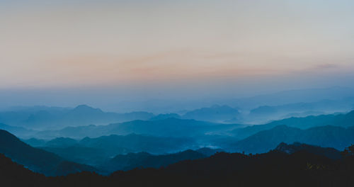 Scenic view of mountains against sky during sunset