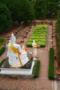 Full length of woman standing in front of built structure