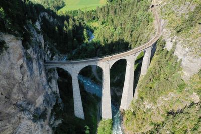 Arch bridge over mountains