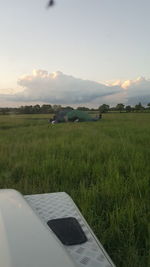 Scenic view of field against sky during sunset