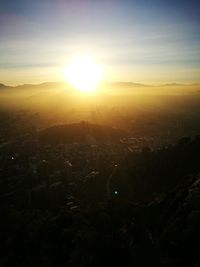 High angle view of buildings against sky during sunset