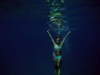 Woman swimming in sea