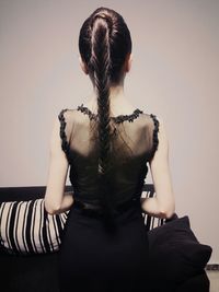 Rear view of woman with braided hair