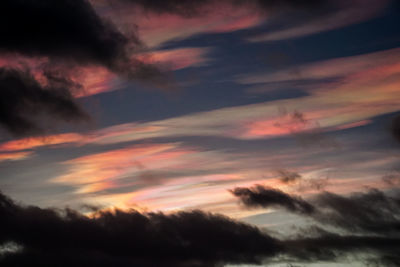 Low angle view of dramatic sky during sunset