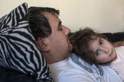 Portrait of father with daughter at home