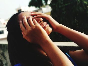 Close-up of couple holding hands