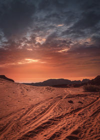 Scenic view of beach against sky during sunset