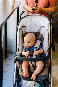 Young mother takes a walk with young baby