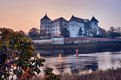 View of bridge over river against buildings