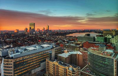 High angle view of illuminated cityscape against sky during sunset