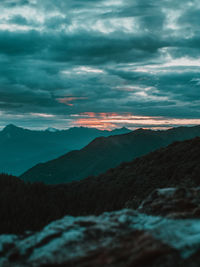 Scenic view of mountain against dramatic sky