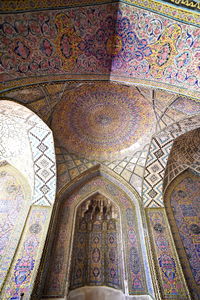 Low angle view of ornate ceiling of building