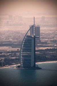 View of city against cloudy sky