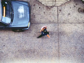 High angle view of man standing on street