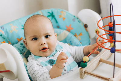 Portrait of cute baby boy at home