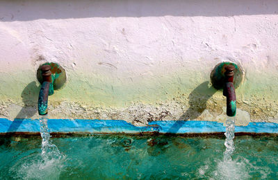 High angle view of woman standing in swimming pool