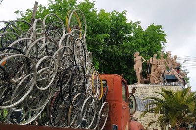 Stack of statue against trees