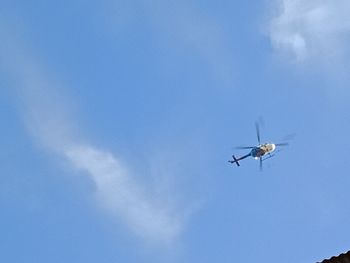 Low angle view of airplane flying in sky