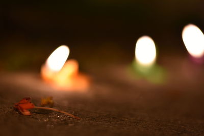 Close-up of illuminated burning at night