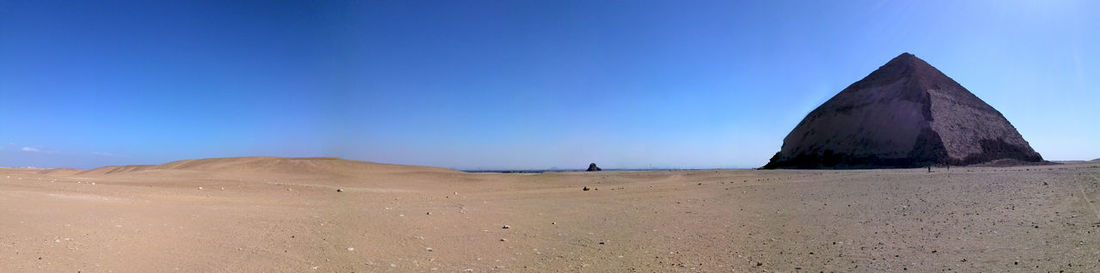 View of desert against blue sky