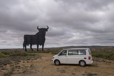 White van in spain with a osborne bull