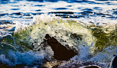 Close-up of waves splashing on rocks
