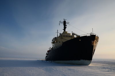 Boat in sea against sky