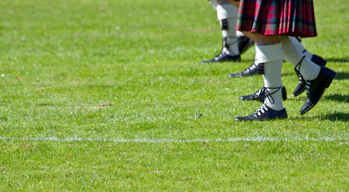 Low section of schoolgirls on soccer field