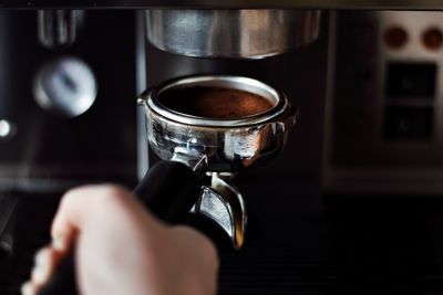 Close-up of hand holding coffee