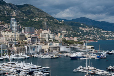 Sailboats moored in harbor