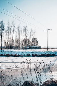 Scenic view of frozen lake against sky during winter