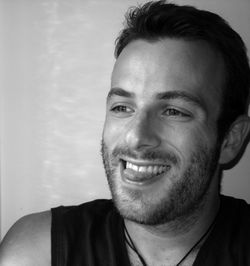 Close-up portrait of smiling young man