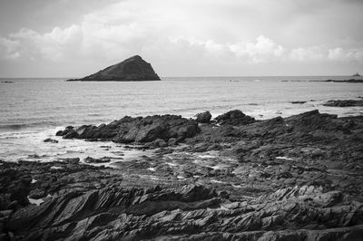 Scenic view of sea against cloudy sky