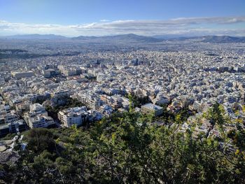 Aerial view of cityscape against sky