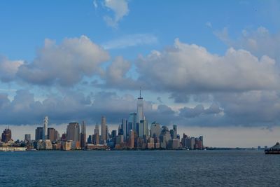 Panoramic view of sea and buildings against sky