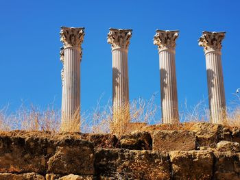 Low angle view of old ruins against sky