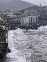 Sea by buildings in city