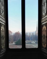 Scenic view of mountains seen through window