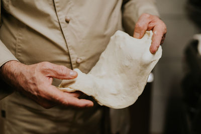 Midsection of man preparing food