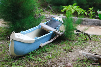 Abandoned boat moored in water